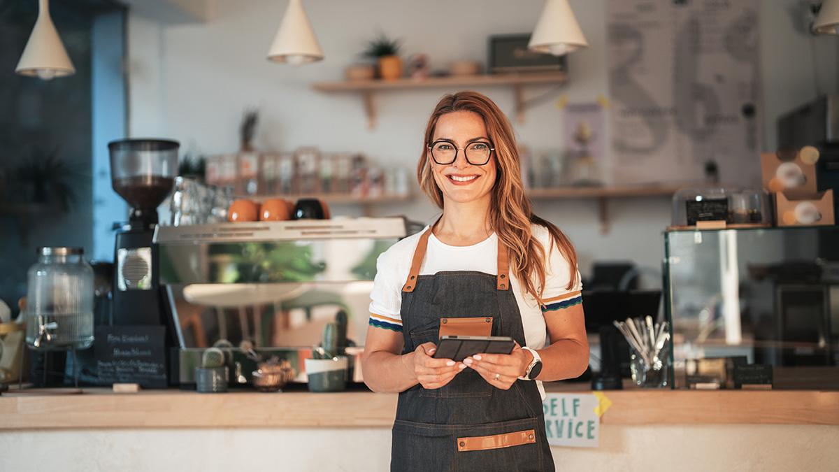 Barista standing in front of coffee counter